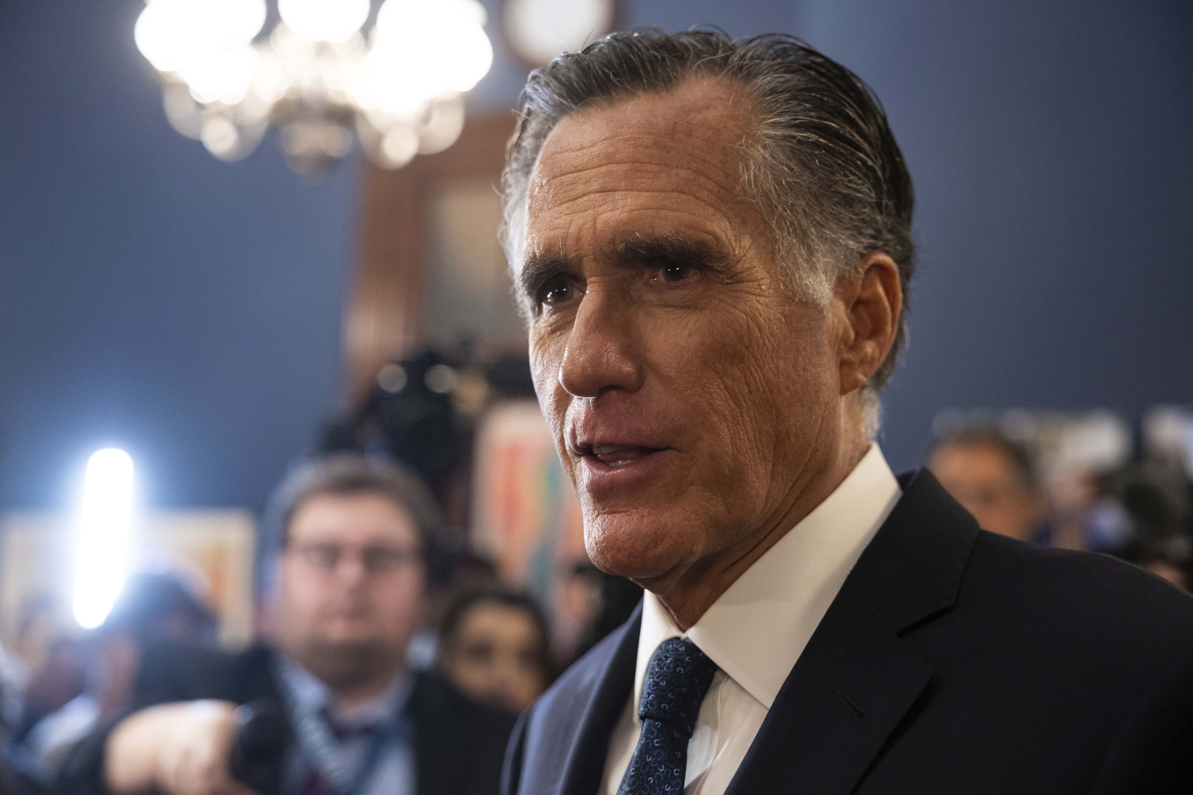 Sen. Mitt Romney speaks with reporters in his office on Capitol Hill Sept. 13, 2023.