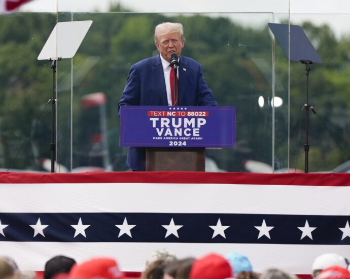 the-traitor-speaks-behind-bulletproof-glass-at-1st-outdoor-rally-since-attempted-assassination