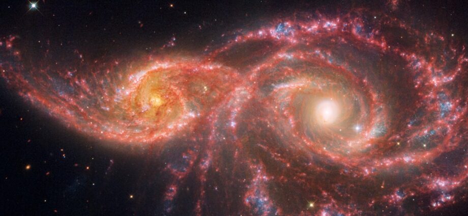 Stare into the ‘blood-soaked eyes’ of 2 spooky galaxies in new Hubble, JWST images (video)