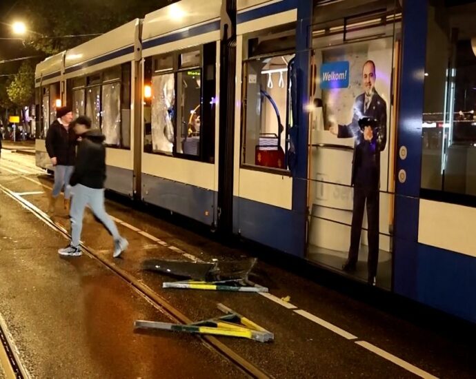 dutch-police-disperse-people-from-streets-after-amsterdam-tram-set-on-fire