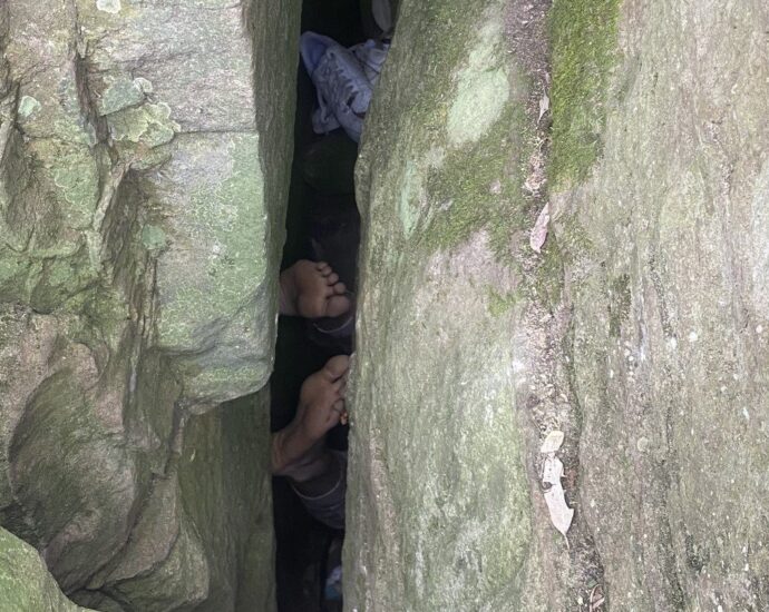 woman-stuck-upside-down-under-rock-for-hours-after-trying-to-retrieve-dropped-phone