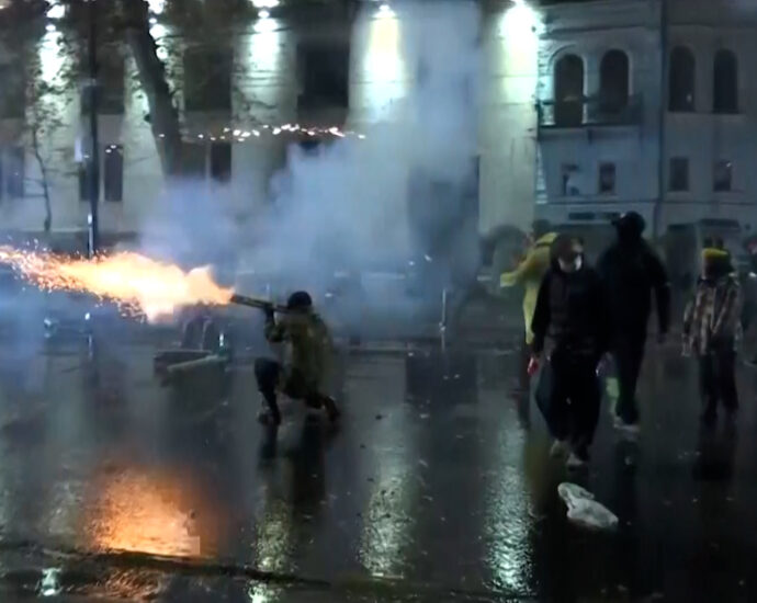 video:-protesters-in-georgia-shoot-fireworks-at-riot-police