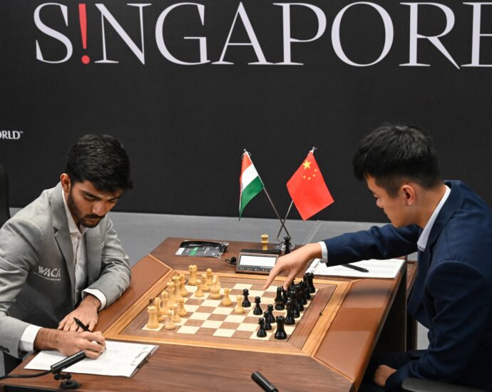 world-chess-champ-ding-and-teen-challenger-gukesh-tied-past-halfway-mark