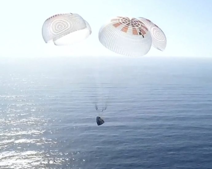 Four space tourists return to Earth after a private flight over the poles
