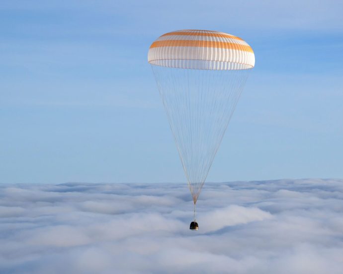A Soyuz capsule with 2 Russians and 1 American returns to Earth from the International Space Station