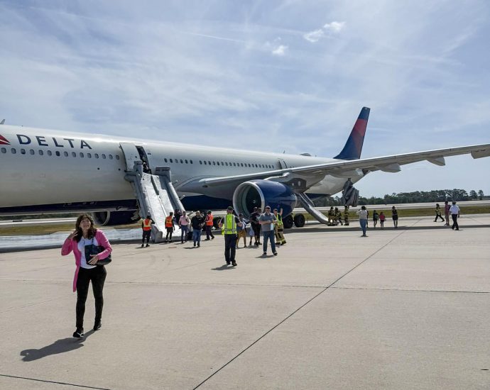 passengers-on-delta-flight-evacuate-on-slides-after-engine-fire-at-orlando-airport