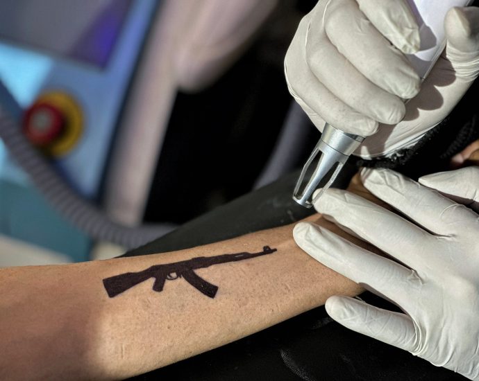 ‘fear-is-real’:-why-young-kashmiris-are-removing-tattoos-of-guns,-‘freedom’