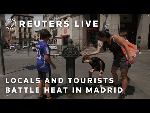 live:-locals-and-tourists-battle-the-heat-in-madrid