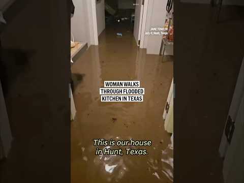 woman-walks-through-flooded-kitchen-in-hunt,-texas
