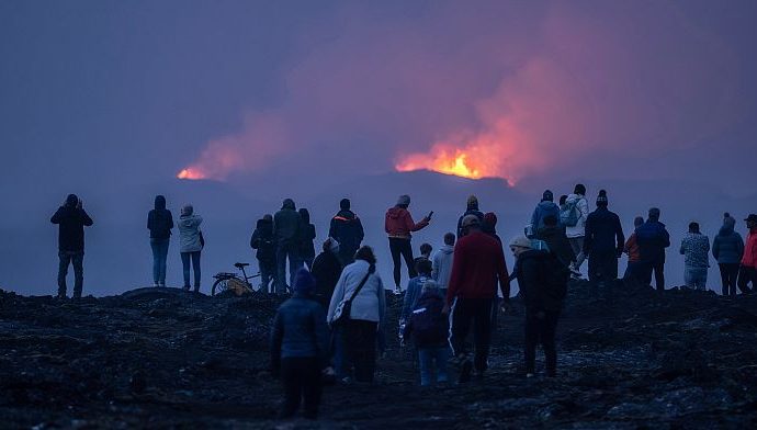 tourists-watch-cooling-lava-as-iceland’s-volcanic-activity-slows