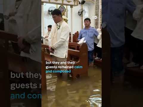 filipino-couple-walk-down-flooded-aisle-on-wedding-day-|-dw-news