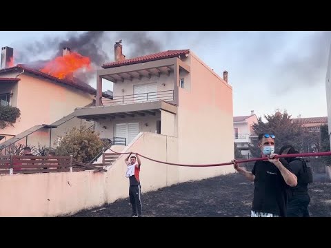 greek-residents-defend-homes-as-wildfire-tears-through-village-|-reuters