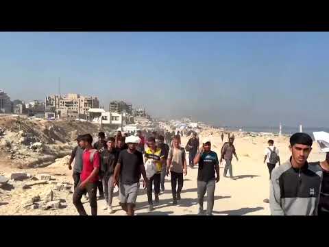 gazans-collect-aid-as-israel-announces-partial-humanitarian-pause-|-reuters