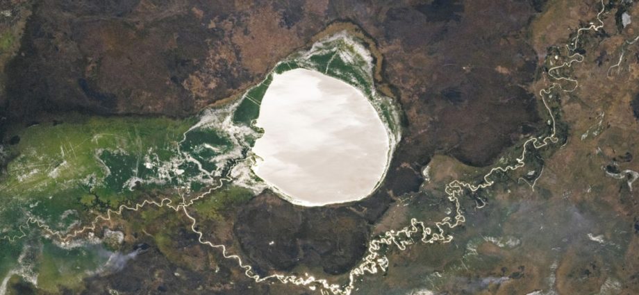 Lake-filled impact crater in Africa transforms into a giant silver ‘mirror’ via rare phenomenon — Earth from space