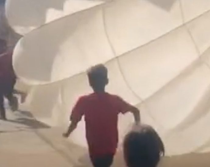 children-in-gaza-play-games-with-aid-drop-parachute