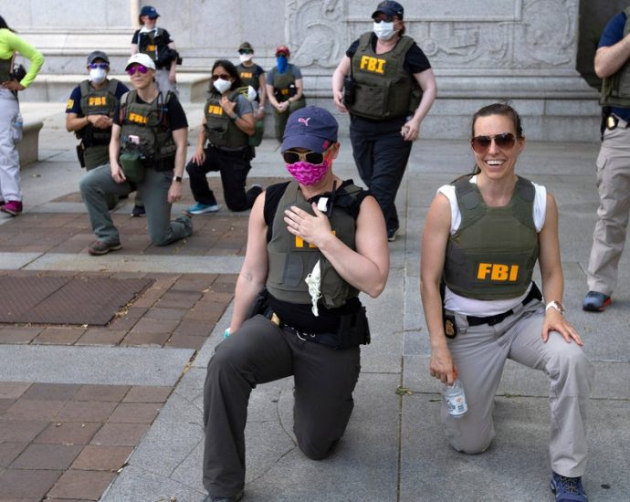fbi-fires-agents-pictured-kneeling-during-2020-racial-justice-protest:-ap