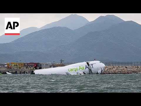 cargo-plane-skids-off-hong-kong-runway,-collides-with-security-car,-killing-2