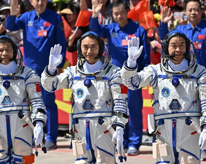 Three Chinese astronauts stranded in space after debris hits their return capsule