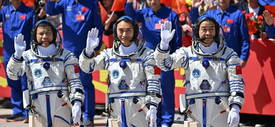 Three Chinese astronauts stranded in space after debris hits their return capsule