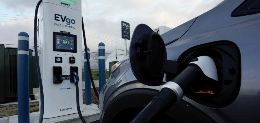 Companies hit the brakes on EVs, lay off thousands