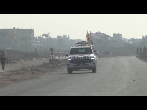 red-cross-vehicles-carrying-what-is-believed-to-be-the-remains-of-a-hostage-drive-in-central-gaza