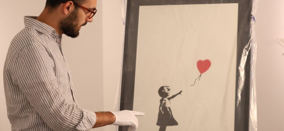 man-jailed-for-‘smash-and-grab’-theft-of-banksy’s-girl-with-balloon-print