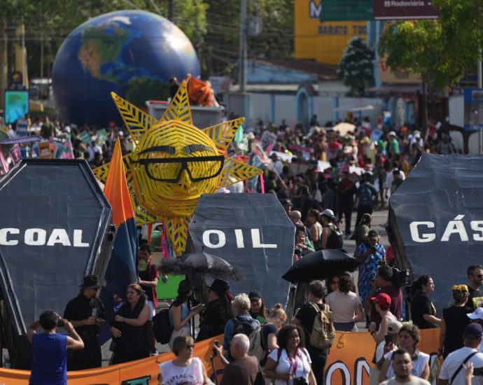 In Brazil, demonstrators march to press negotiators for progress at UN climate talks