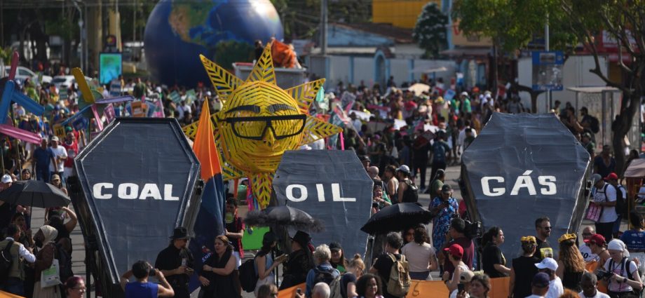 In Brazil, demonstrators march to press negotiators for progress at UN climate talks