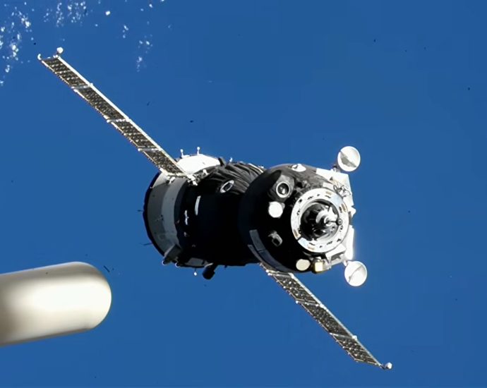 three-new-crew-members-aboard-soyuz-dock-to-station