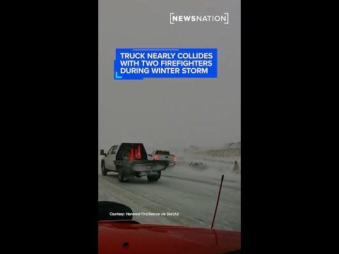 truck-nearly-collides-with-two-firefighters-during-winter-storm