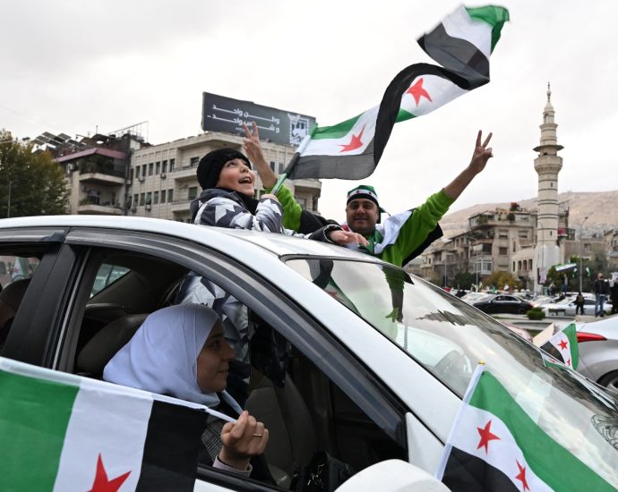 celebrations,-military-parade-mark-one-year-since-fall-of-assad