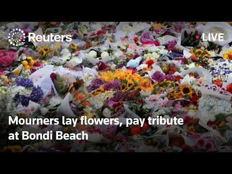 live:-mourners-lay-flowers-and-pay-tribute-at-bondi-beach