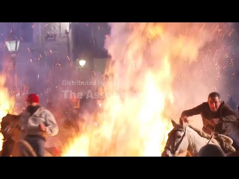 horses-leap-through-flames-as-part-of-spanish-ritual-to-honor-st.-anthony,-ap-explains