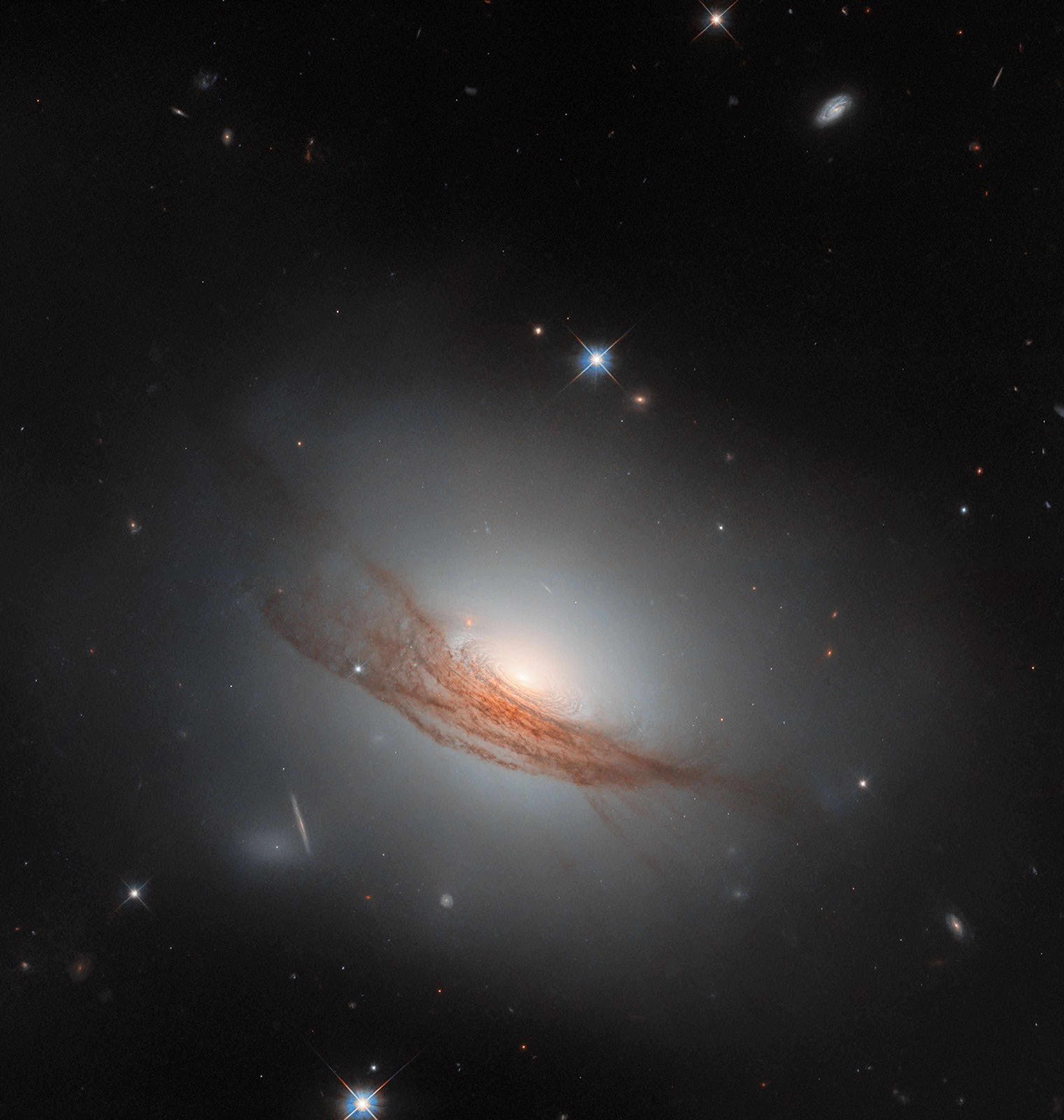 hubble-sees-galaxy-with-dark-rings-in-new-light