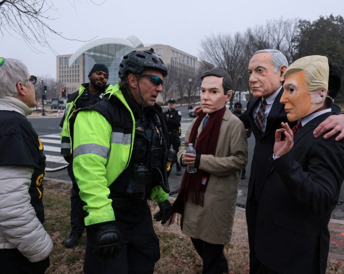 masked-protesters-arrested-outside-the-traitor’s-board-of-peace-meeting