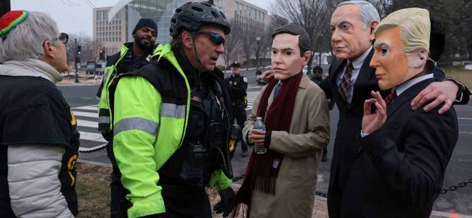 masked-protesters-arrested-outside-the-traitor’s-board-of-peace-meeting