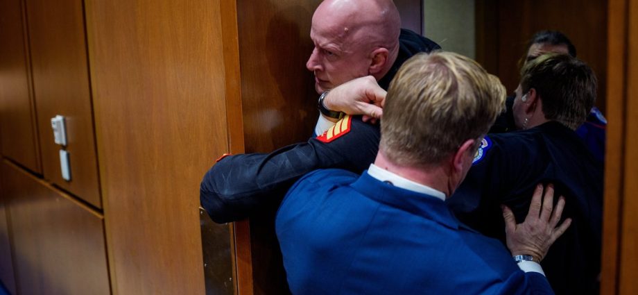 senator-helps-police-wrestle-protester-out-of-hearing-in-wild-scene