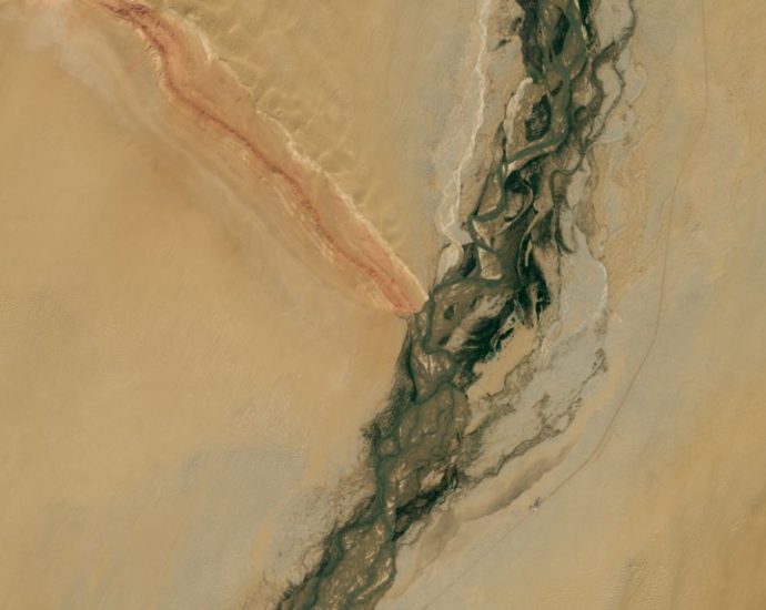 Gemstone-filled river and striped mountain ridge form massive ‘Y’ in China’s revitalized desert — Earth from space