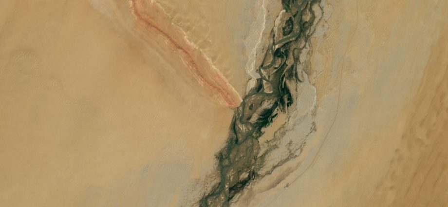 Gemstone-filled river and striped mountain ridge form massive ‘Y’ in China’s revitalized desert — Earth from space