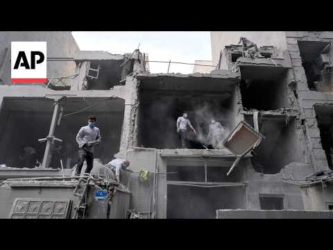 residents-and-workers-clear-debris-after-strikes-in-tehran,-iran