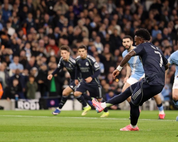 vinicius-jr-scores-twice-as-real-madrid-knock-man-city-out-of-ucl-last-16