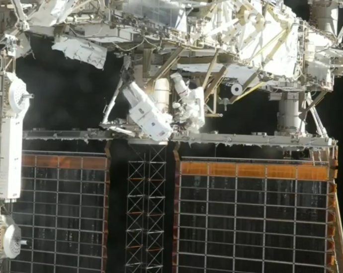 astronauts-install-solar-array-mod-kit,-complete-spacewalk