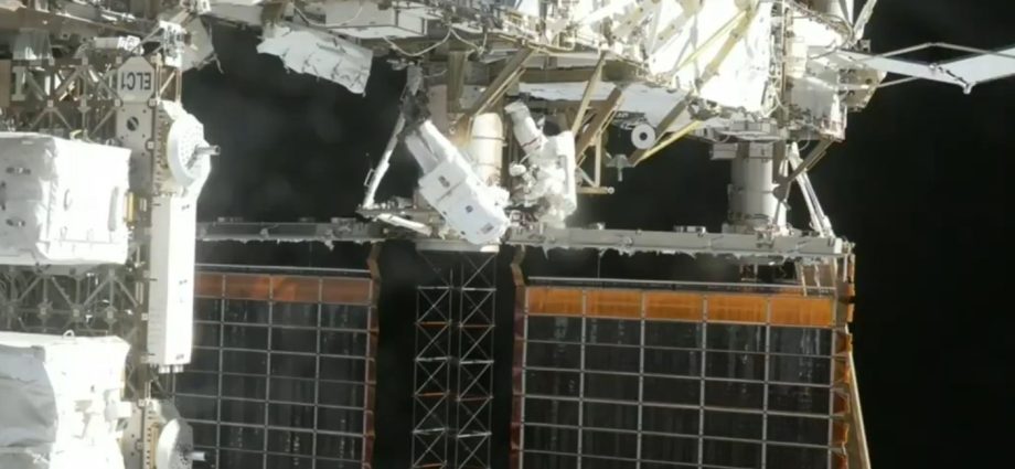 astronauts-install-solar-array-mod-kit,-complete-spacewalk