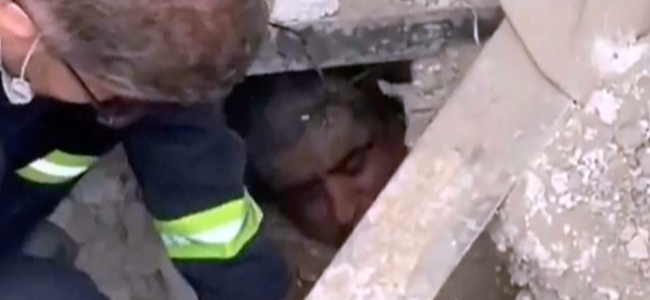 moment-rescuers-find-man-alive-under-the-rubble-in-tehran