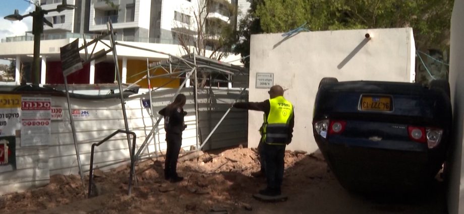 iranian-missile-strike-damages-cars-and-street-in-israel