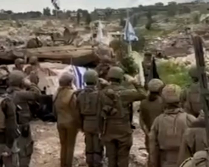 video:-israeli-soldiers-sing-national-anthem-on-ruins-of-lebanese-town