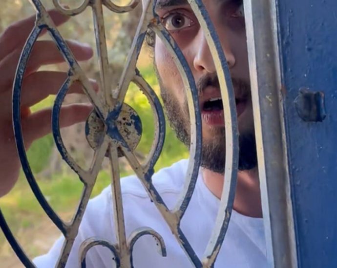 israeli-settler-attacks-hebron-activist’s-home-as-soldier-looks-on