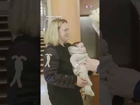 putin-hugs-former-school-teacher,-kremlin-video-shows