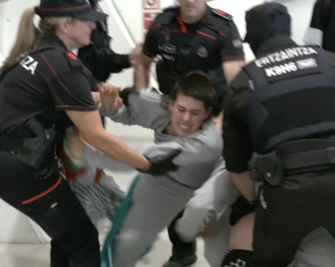 police-beat-and-detain-gaza-flotilla-activists-at-airport