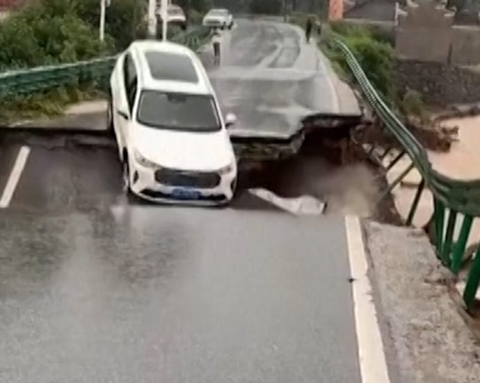 car-swept-away-by-floodwater-after-bridge-collapses-in-china